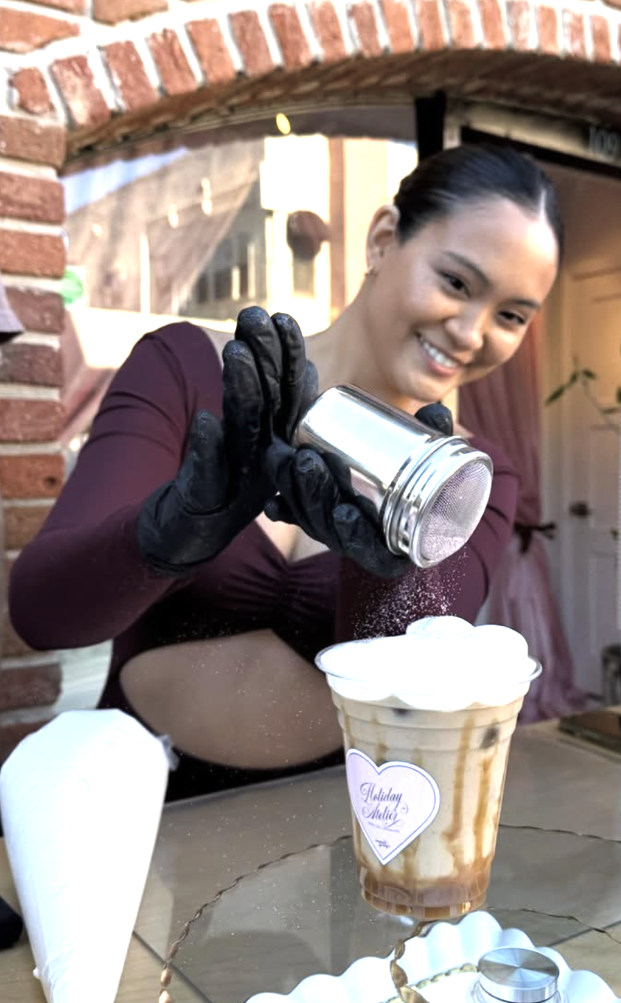 Kelly finishing a drink at a pop-up